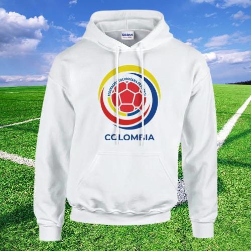 Colombia White hoodie with a colorful logo on a grassy field