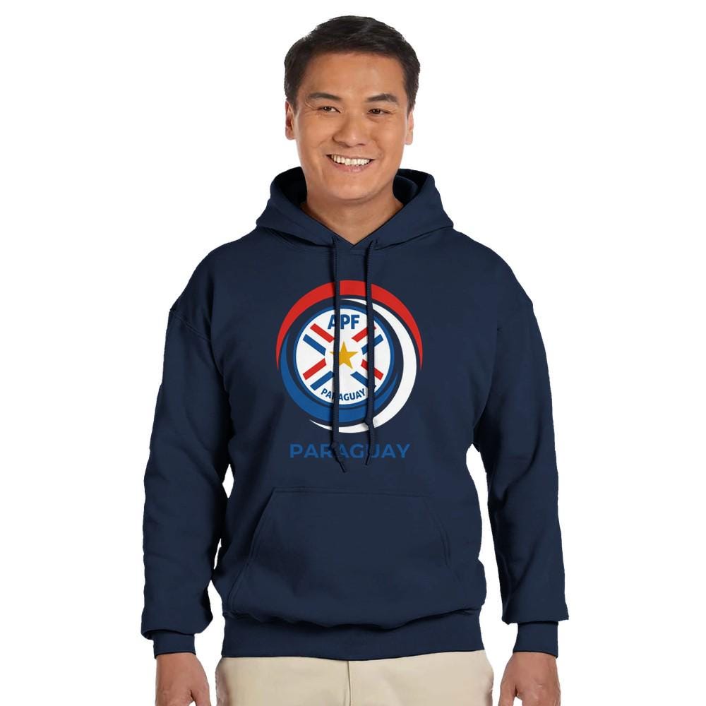 Person wearing a navy hoodie with a logo and text on a white background