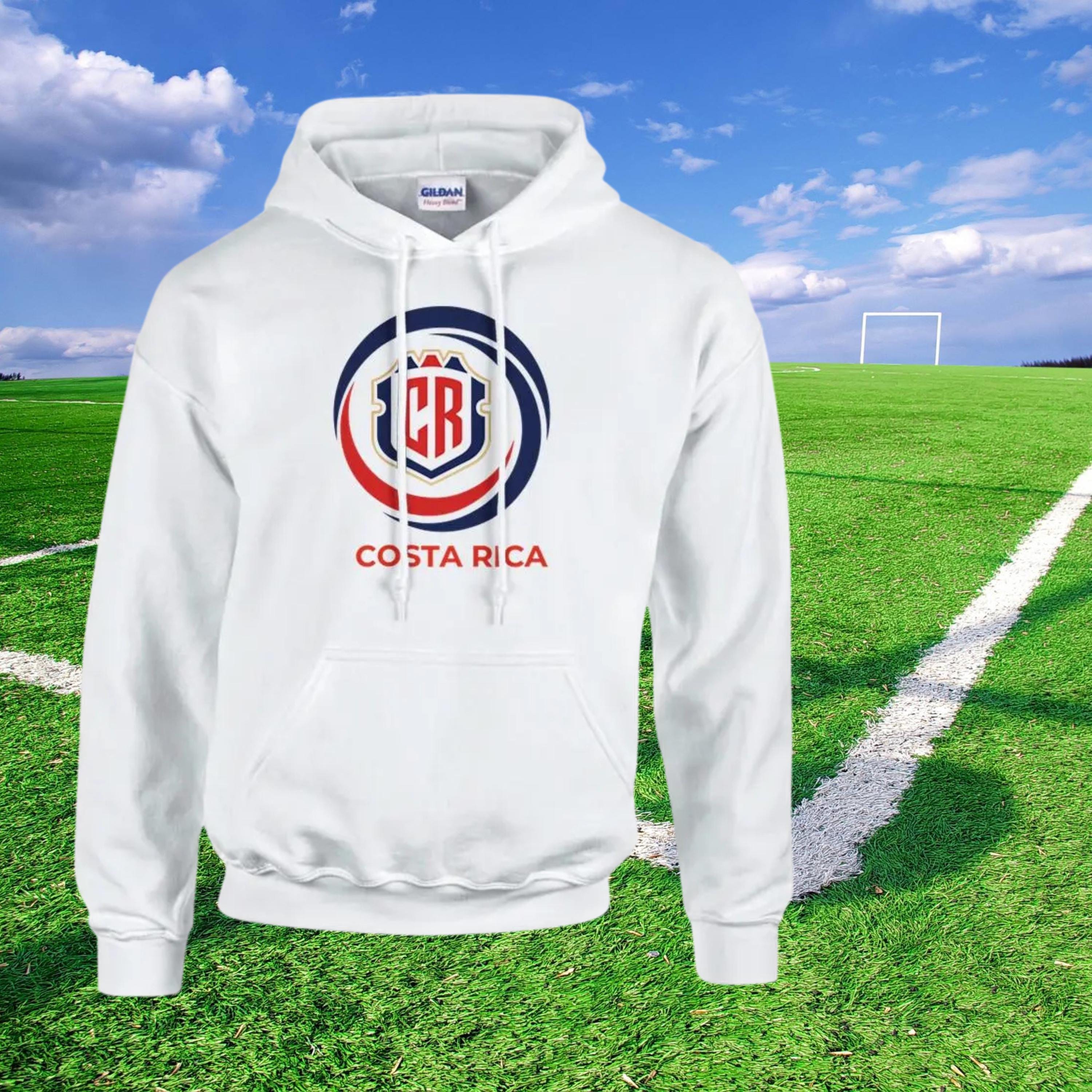 White hoodie with Costa Rica logo on a soccer field