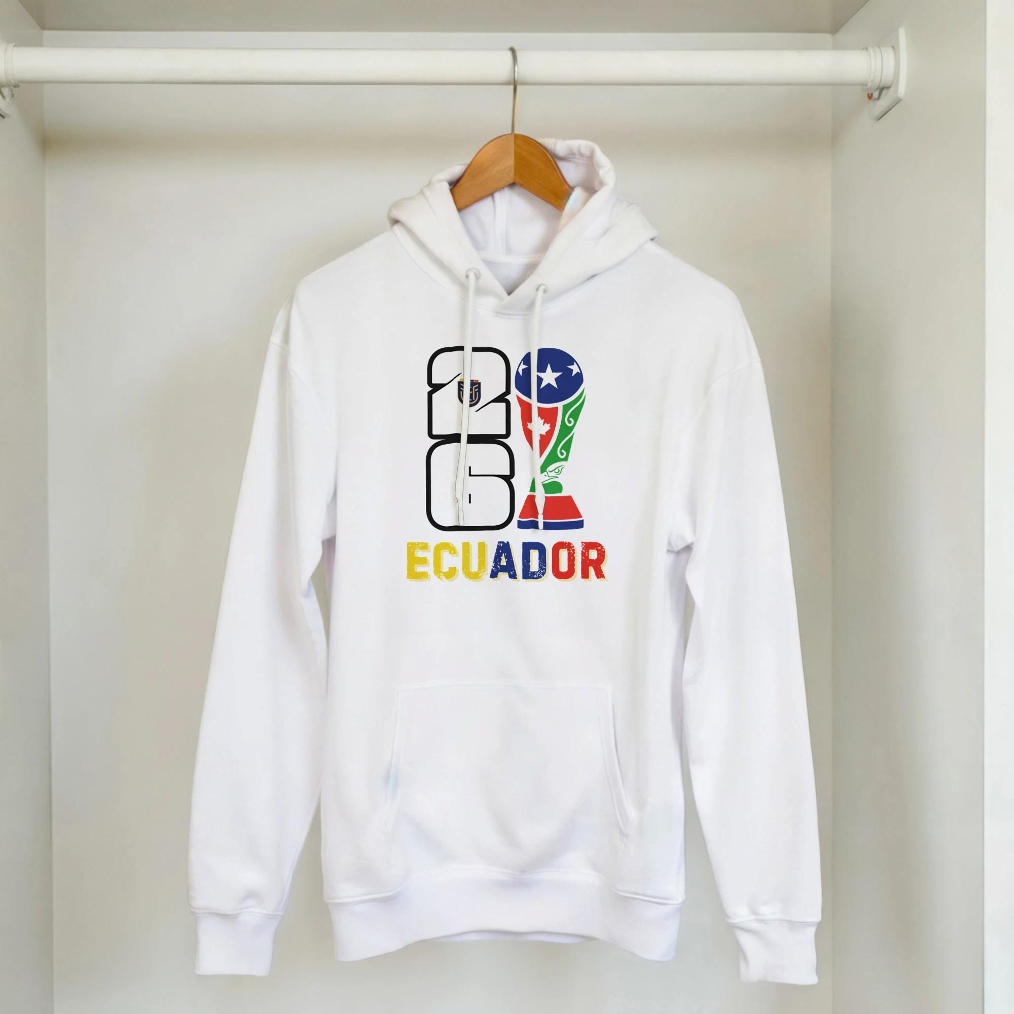 White hoodie with '2016 Ecuador' design on a hanger against a white background
