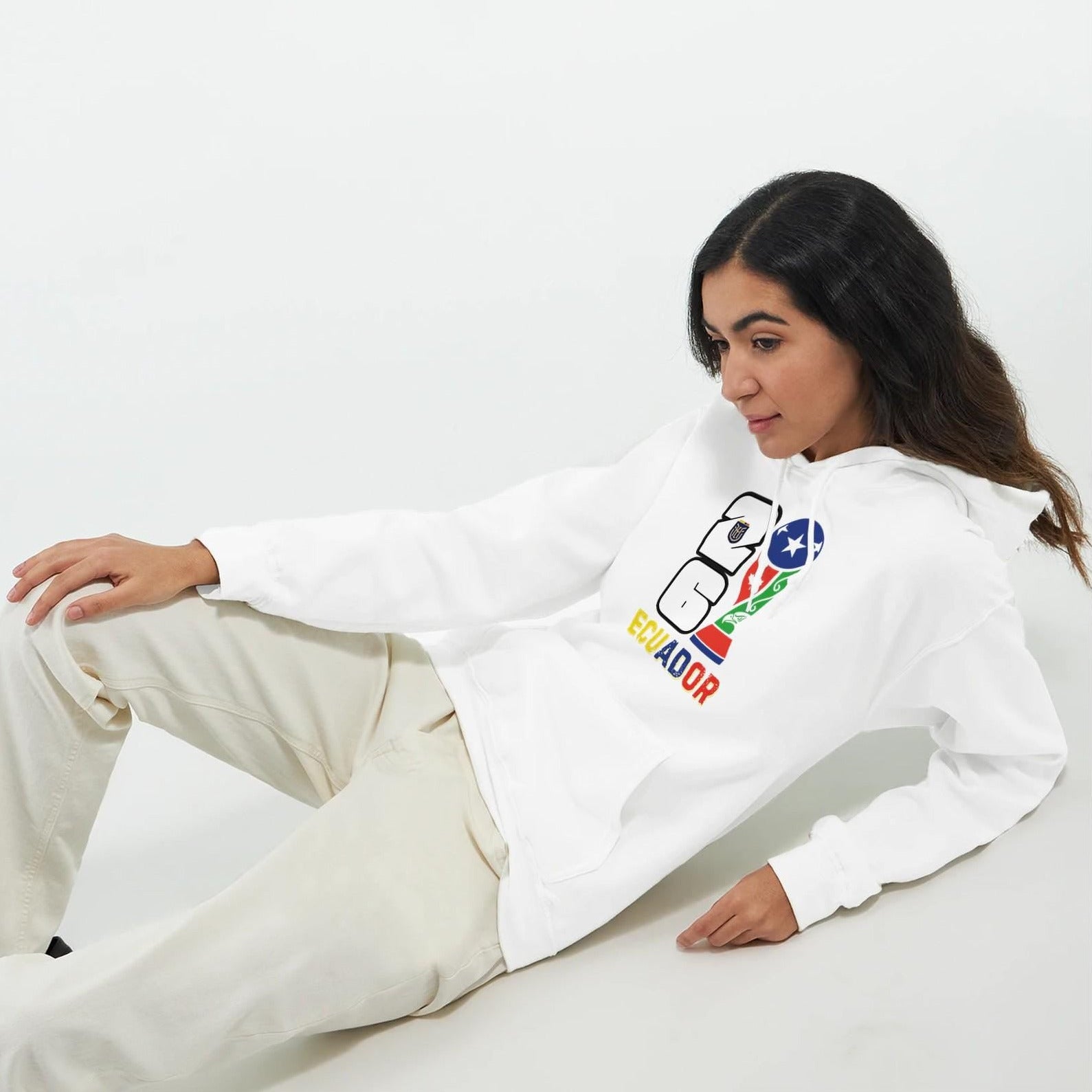 Person wearing a white sweatshirt with colorful graphics on a white background