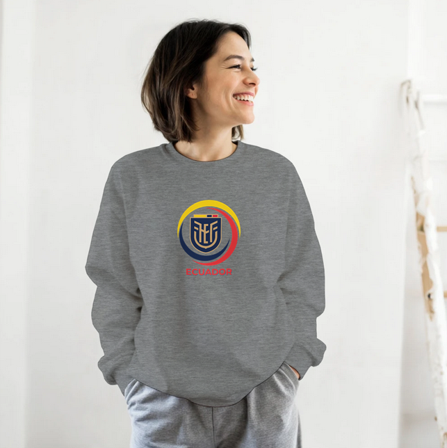 Person wearing a gray sweatshirt with a logo on a white background