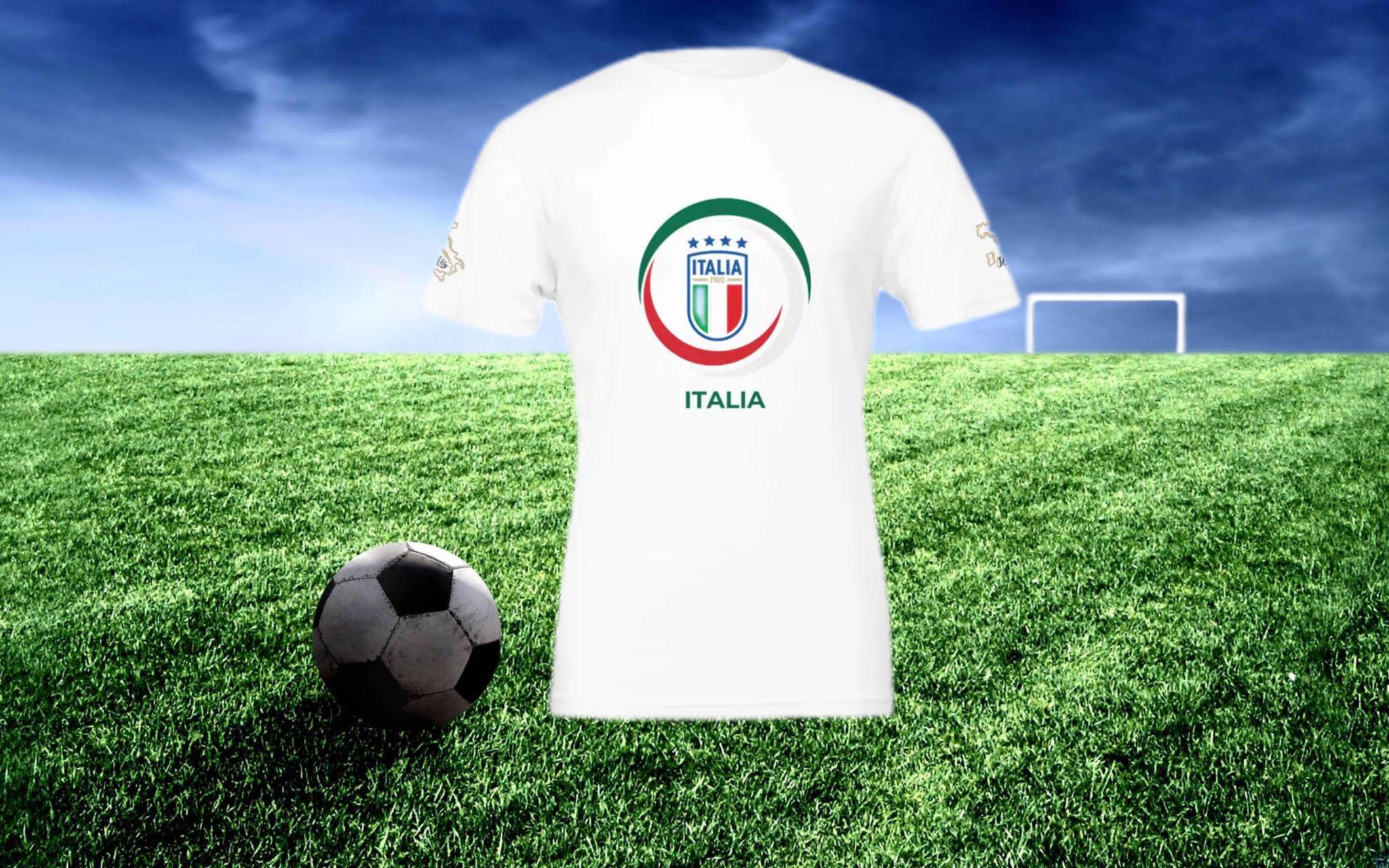 White t-shirt with Italian flag design on a grass field with a soccer ball and goal.